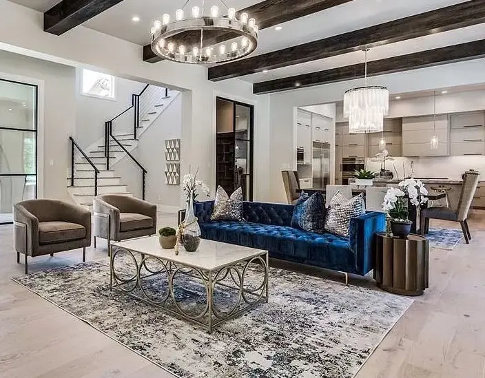 Staged living room with a blue sofa