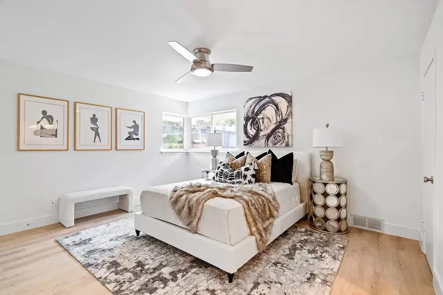 Fully furnished bedroom with contemporary artwork