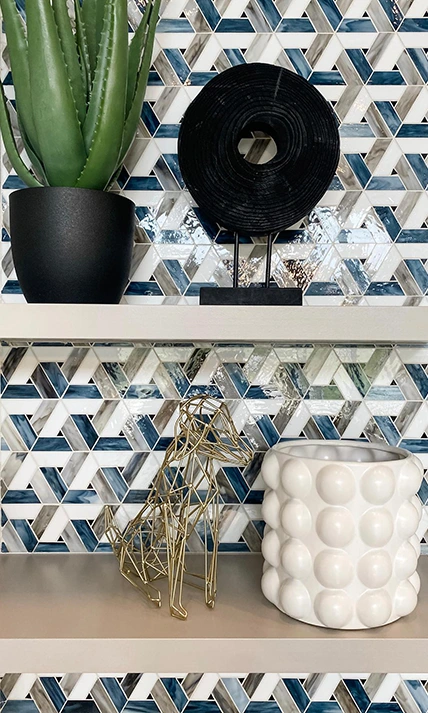Shelves staged with black, white and metal accessories