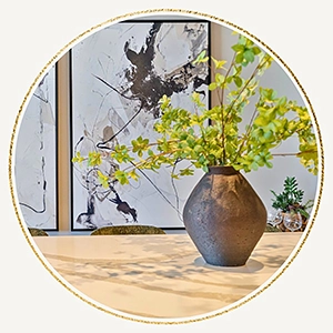 Large vase with greenery and black and white abstract art
