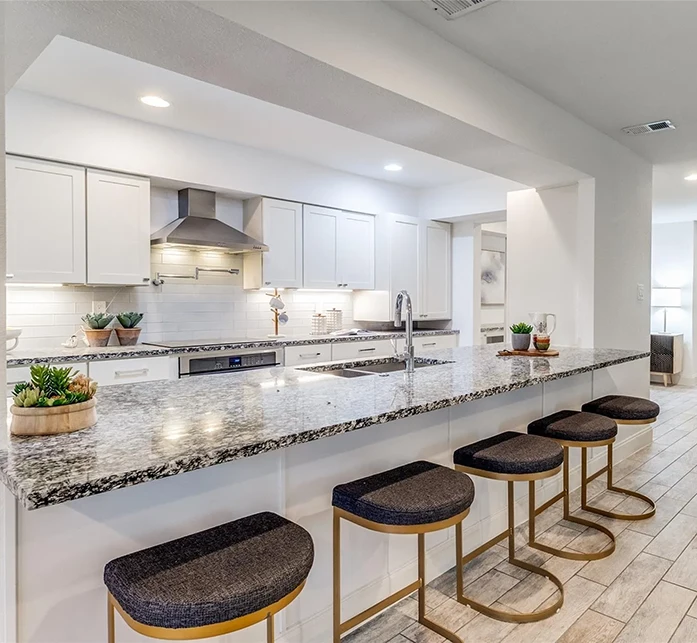 Staged kitchen with modern counterstools and kitchen accessories